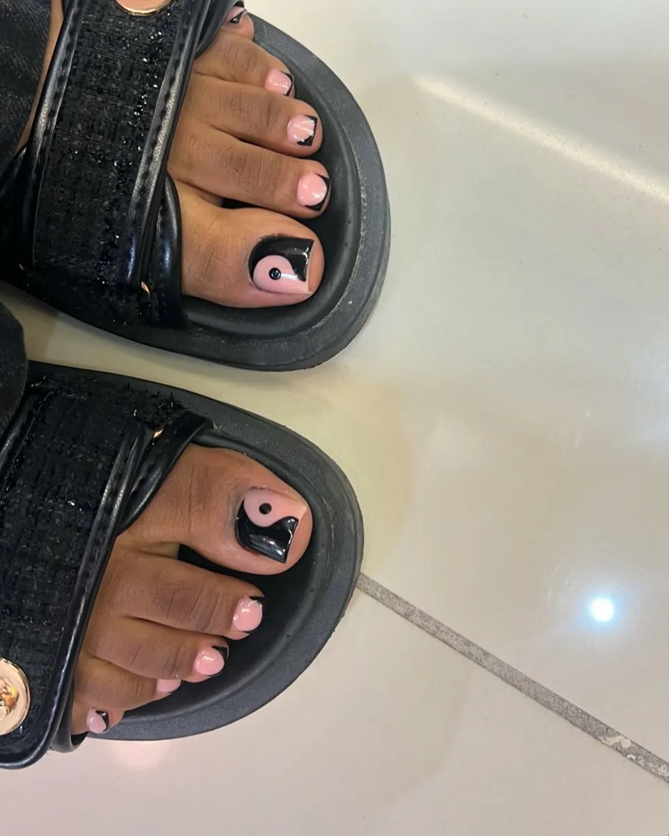 Gel pedicure, black with pink accents